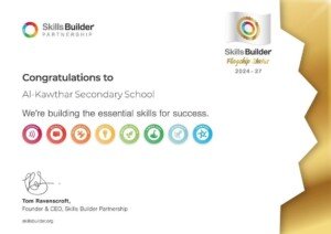 شهادة تقدير بيضاء من مؤسسة Skills Builder البريطانية تحمل عبارة تهنئة لثانوية الكوثر بمرتبة الوضع الرائد 2024-2027 | A white certificate of recognition from the British Skills Builder Partnership congratulating Al-Kawthar Secondary School on Flagship Status for 2024-2027