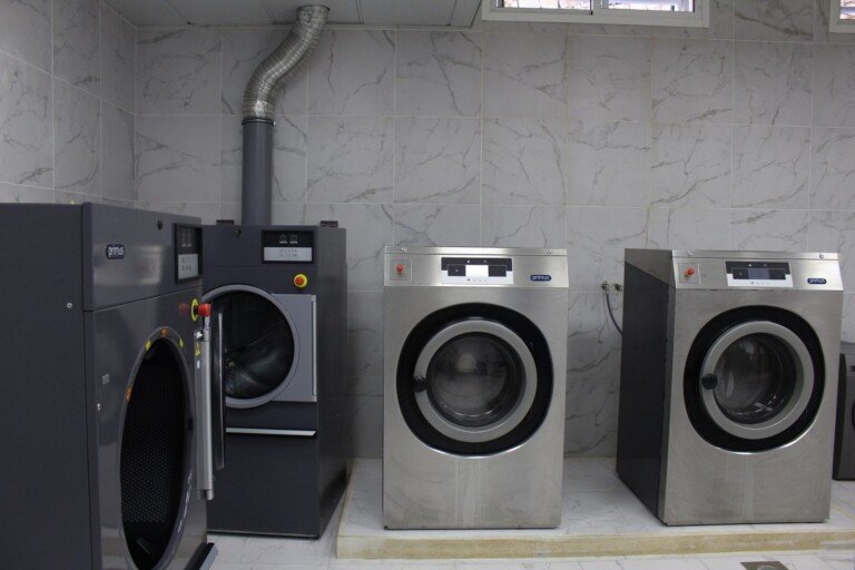 آلات غسيل صناعية داخل غرفة مغسلة في مبرة الإمام الرضا (ع) في لبنان | Industrial washing machines inside a laundry room at Imam Al-Ridha Institution in Lebanon