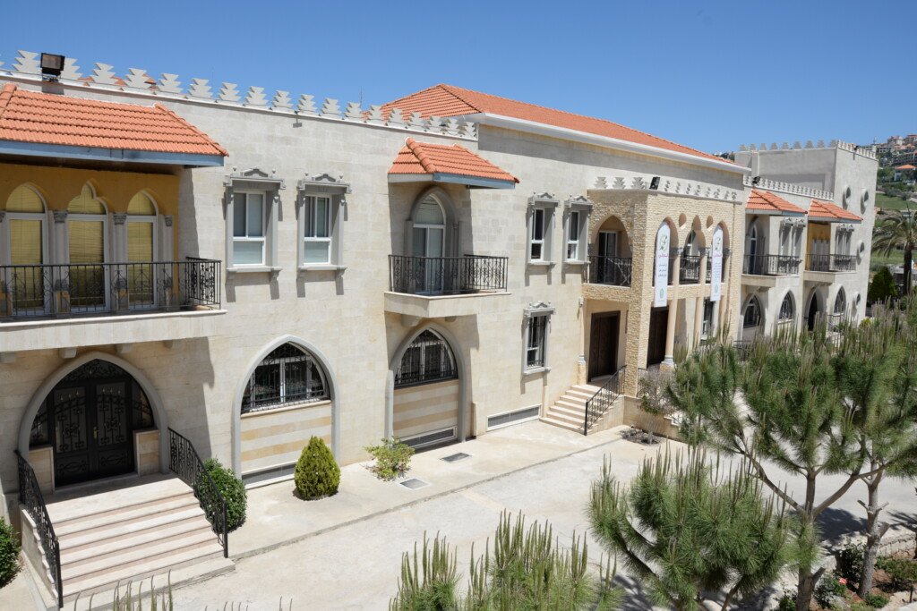 مبنى مبرة النبي إبراهيم (ع) الحجري في الخيام بقناطره وسقفه القرميدي | The stone building of Al-Nabi Ibrahim Mabarra in Khiam with its arches and red-tiled roof